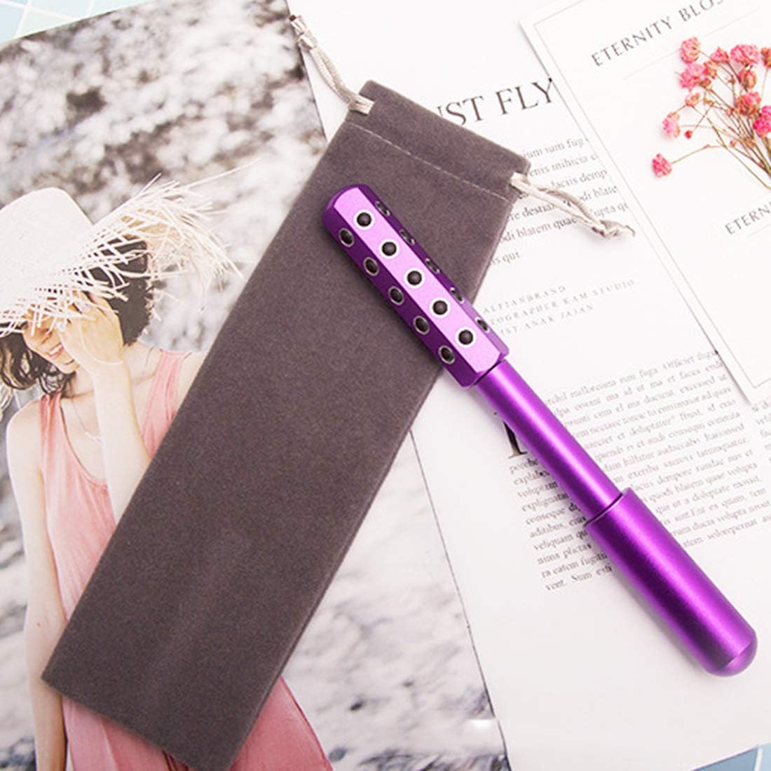 Germanium roller on table – beauty tool for daily anti-aging and facial contour routine Purple