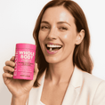 Carica immagine nel visualizzatore Galleria, Smiling woman holding Ellasie Whole Body Daily Probiotic. Promotes gut health & feminine wellness.
