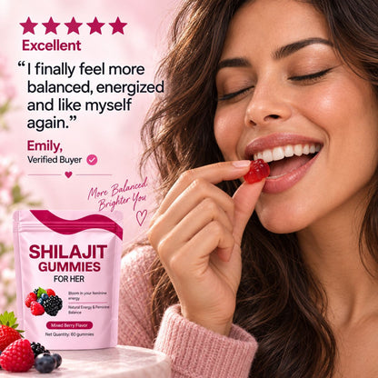 A woman in a pink sweater is shown eating a berry gummy, with a pink product pouch labeled 'BLOOMIN GUMMIES FOR HER' and a customer review quote on a soft pink background.