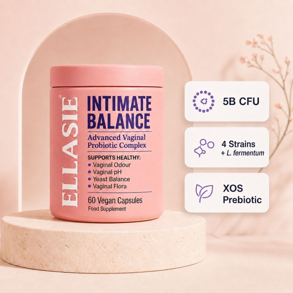 Pink container of ELASIE Intimate Balance Advanced Vaginal Probiotic Complex on a beige background