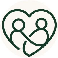 A dark green minimalist line icon depicting two figures inside a heart, centered on a light beige circular background.