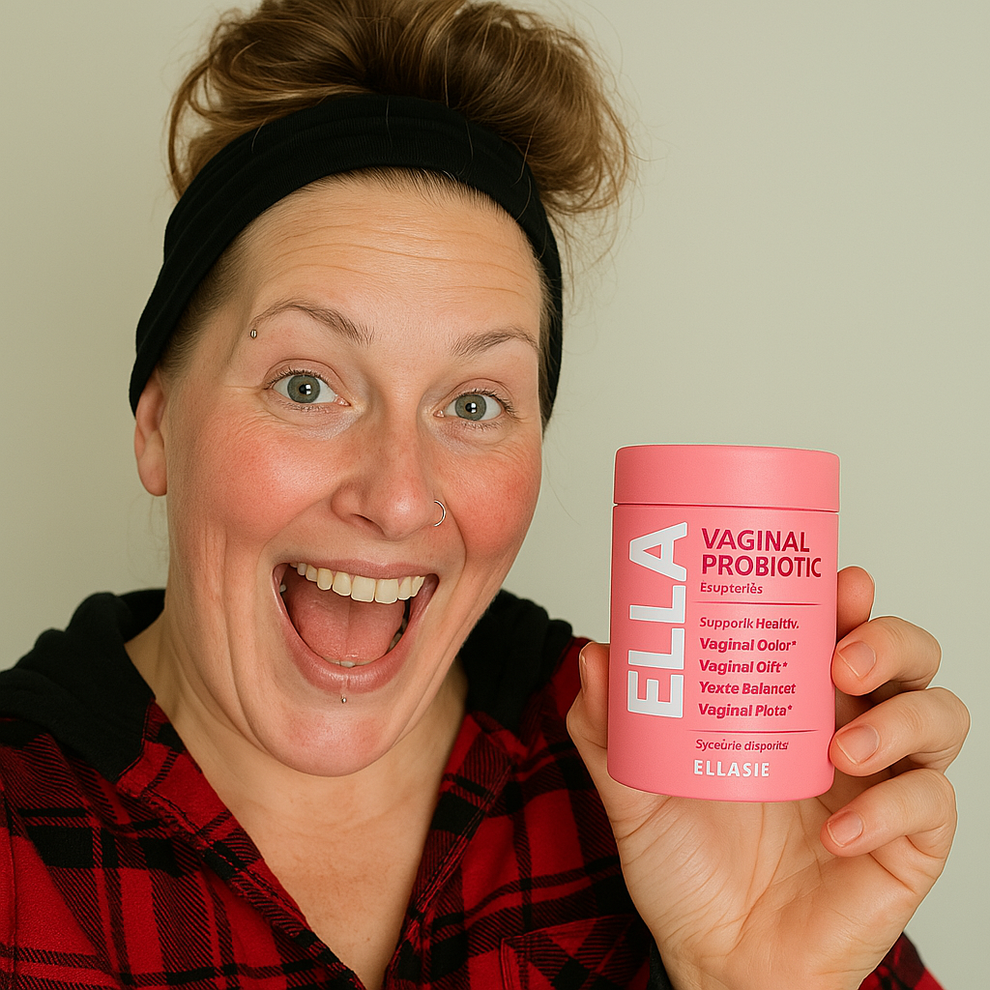 Woman in a plaid shirt holding a pink supplement container labeled 'Intimate Balance' by ELASIE against a plain background.