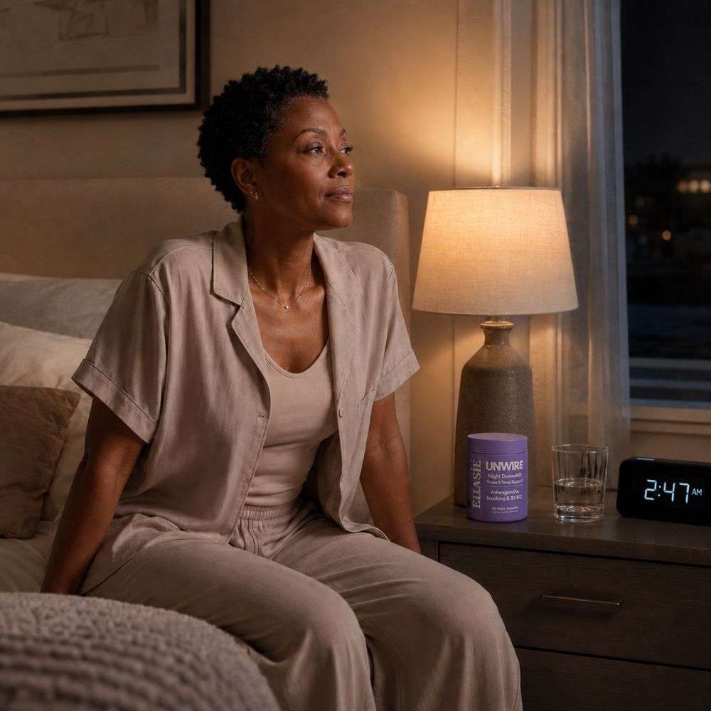 women sat in a bed with a clock 2:47am and a bottle of unwire pm ellasie bottle